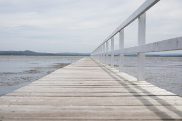Fototapeta premium calm lake water pontoon jetty pontoon long sail row