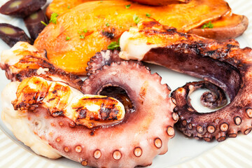 Grilled octopus with potato.