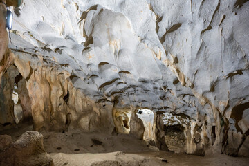Interior of the large hall of old Karain cave, hidden in Mediterranean region. Confirms human habitation since the early Paleolithic age between 150,000 and 200,000 years ago.Yagca, Antalya, Turkey.