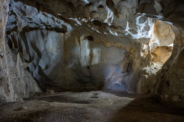 Interior of the large hall of old Karain cave, hidden in Mediterranean region. Confirms human habitation since the early Paleolithic age between 150,000 and 200,000 years ago.Yagca, Antalya, Turkey.