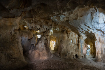 Interior of the large hall of old Karain cave, hidden in Mediterranean region. Confirms human habitation since the early Paleolithic age between 150,000 and 200,000 years ago.Yagca, Antalya, Turkey.
