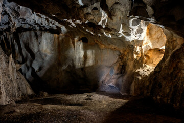 Interior of the large hall of old Karain cave, hidden in Mediterranean region. Confirms human habitation since the early Paleolithic age between 150,000 and 200,000 years ago.Yagca, Antalya, Turkey.