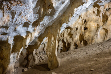Interior of the large hall of old Karain cave, hidden in Mediterranean region. Confirms human habitation since the early Paleolithic age between 150,000 and 200,000 years ago.Yagca, Antalya, Turkey.