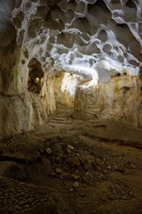 Interior of the large hall of old Karain cave, hidden in Mediterranean region. Confirms human habitation since the early Paleolithic age between 150,000 and 200,000 years ago.Yagca, Antalya, Turkey.