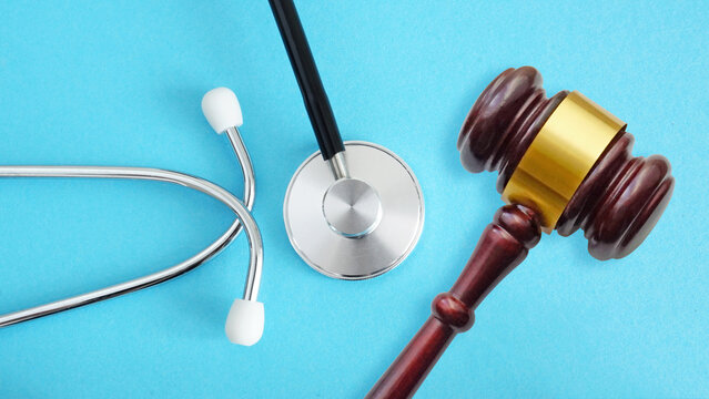 Medical Law and Ethics are shown with stethoscope and gavel. Healthcare legislation and regulation, medical malpractice decision and health care injury personal attorney