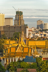 The throne hall inside the royal palace and new skyscraper in Phnom Penh, Cambodia