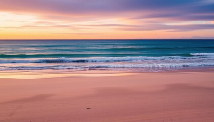 Fototapeta premium the beach at sunset with waves crashing