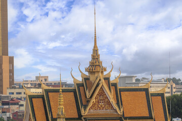 Fototapeta premium The silver pagoda inside the royal palace and new skyscraper in Phnom Penh, Cambodia