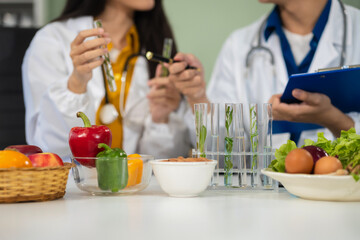 Microbiologists and nutrition experts analyze molecular samples in advanced food science labs,...