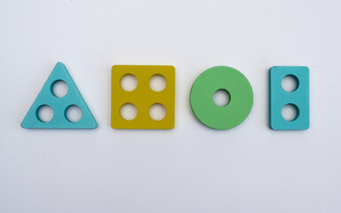 Four different geometric shapes - triangle, square, circle, rectangle. concept. on a white background. elements of a children's logic game