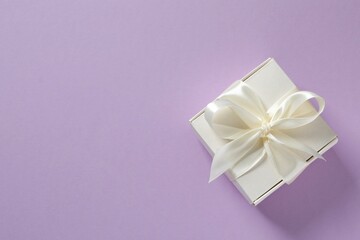 Beautiful gift box on color background 