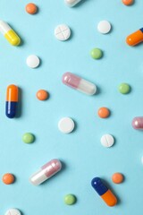 Various pills on a colored background