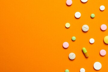 Various pills on a colored background