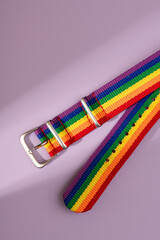 Colored lgbt bracelet on bright background.