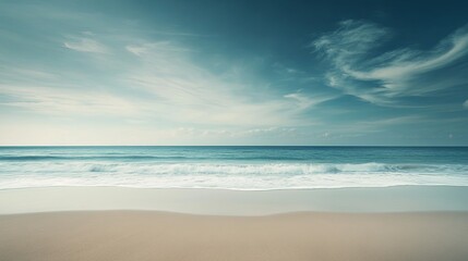 A serene and picturesque beach landscape unfolds with gentle waves lapping at the shore beneath a clear sky, all set against the backdrop of a tropical paradise during the enchanting late afternoon