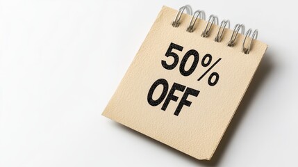 50 Off Sale Announcement A Square Spiral Notepad Lies Open With a 50 Percent Discount Offer