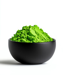 Green matcha powder in a sleek black bowl on a white background, showcasing its vibrant color and fine texture.