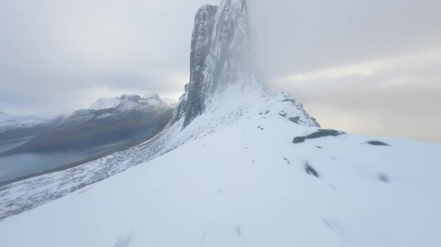 FPV Drone Flying Along Cliff Towards Segla, Senja, Norway