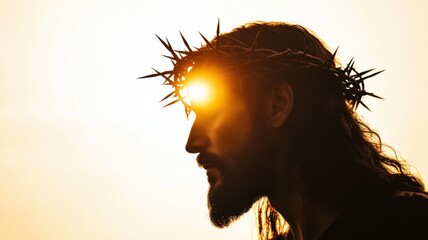 Silhouette of Jesus with a crown of thorns on his head, facing away from the camera