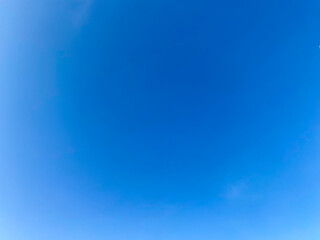 sky is blue and clear with no clouds. The sky is very bright and the sun is shining