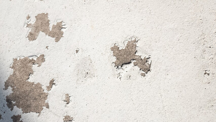 The white walls are peeling off.