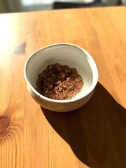 Chocolate oatmeal porridge on wooden table