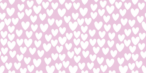 Seamless abstract pattern of small white hearts on pink background. Love backdrop, cute texture for textile, wrapping paper, Valentine's day.