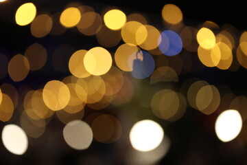 Obraz premium defocused christmas light bokeh in a christmas market