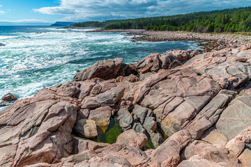 A view across a wave cut platform down the coast at Green cove, Ingonish on the Cabot Trail Nova...