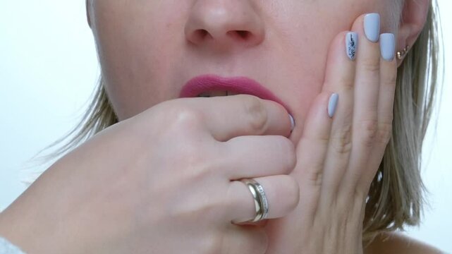 Woman with toothache taking out a tooth from mouth, losing teeth sickness