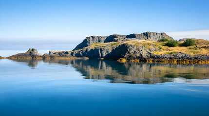 Calm Coastal Cliffs Reflecting in Serene Ocean Waters.