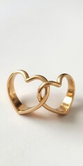 Pair of heart-shaped wedding bands, gold, close-up, commitment, wedding
