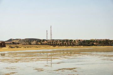 Marsa Alam, Egypt, july 21 2024, Beach view in Marsa Alam. Umbrellas on the hotel beach. Typical Egyptian architecture