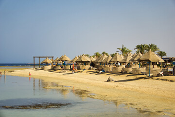 Marsa Alam, Egypt, july 21 2024, Beach view in Marsa Alam. Umbrellas on the hotel beach. Typical Egyptian architecture
