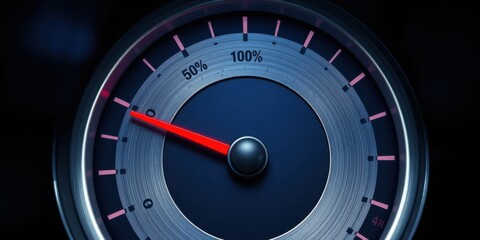 A close-up image of a brushed metal gauge with a red needle pointing to 100% on a dark background