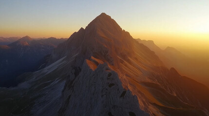 Obraz premium golden rays illuminate the snow-capped peaks