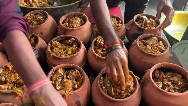 Mutton is stuffed in an earthen pot to prepare Handi mutton in Bihar, India.
