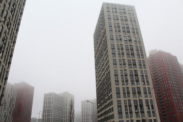 Obraz premium city skyscrapers, modern architecture in Kyiv Ukraine, skyscrapers in the city and fog