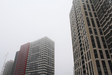 Fototapeta premium city skyscrapers, modern architecture in Kyiv Ukraine, skyscrapers in the city and fog