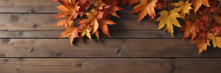 Obraz premium Autumn maple branch with leaves in front of a wooden background, wooden wall, rustic decor