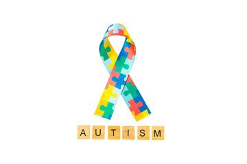 Autism ribbon. Autism awareness day. World autism awareness day with puzzle pattern ribbon on textured background. Colorful puzzle ribbon. Medicine concept. Space for text. Copy space
