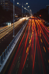Obraz premium Blurred car traffic light at night city. Traffic jam in evening rush hour.