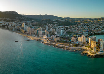 Obraz premium Spectacular coastline of Calpe at sunset. Beautiful panoramic view of all region. Luxury urbanisations and Hotels. Famous travel destination in Alicante, Costa Blanca, Spain. Sunset point.