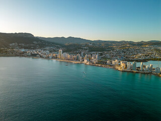 Obraz premium Spectacular coastline of Calpe at sunset. Beautiful panoramic view of all region. Luxury urbanisations and Hotels. Famous travel destination in Alicante, Costa Blanca, Spain. Sunset point.