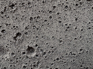 Hardened wet ash forms a texture similar to the moon's surface or bacterial colonies. Trypophobia alert: Do not look