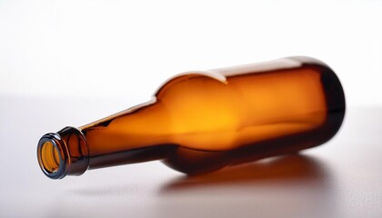 empty beer bottle made of brown glass remoted on a white heritage