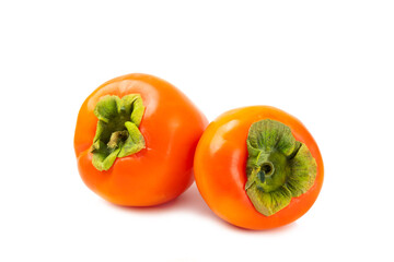 Persimmon isolated on white background. Persimmon fruit. Slice of ripe, juicy, sweet persimmon fruit. Vegan. Fruit garden. Close-up.