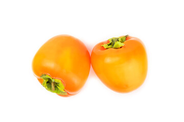 Persimmon isolated on white background. Persimmon fruit. Slice of ripe, juicy, sweet persimmon fruit. Vegan. Fruit garden. Close-up.