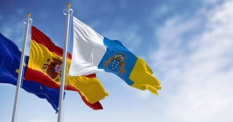 Canary Islands , spanish and EU flag waving in the wind