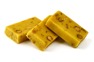 Saffron nougat bar with almonds and pistachios, isolated on white background.